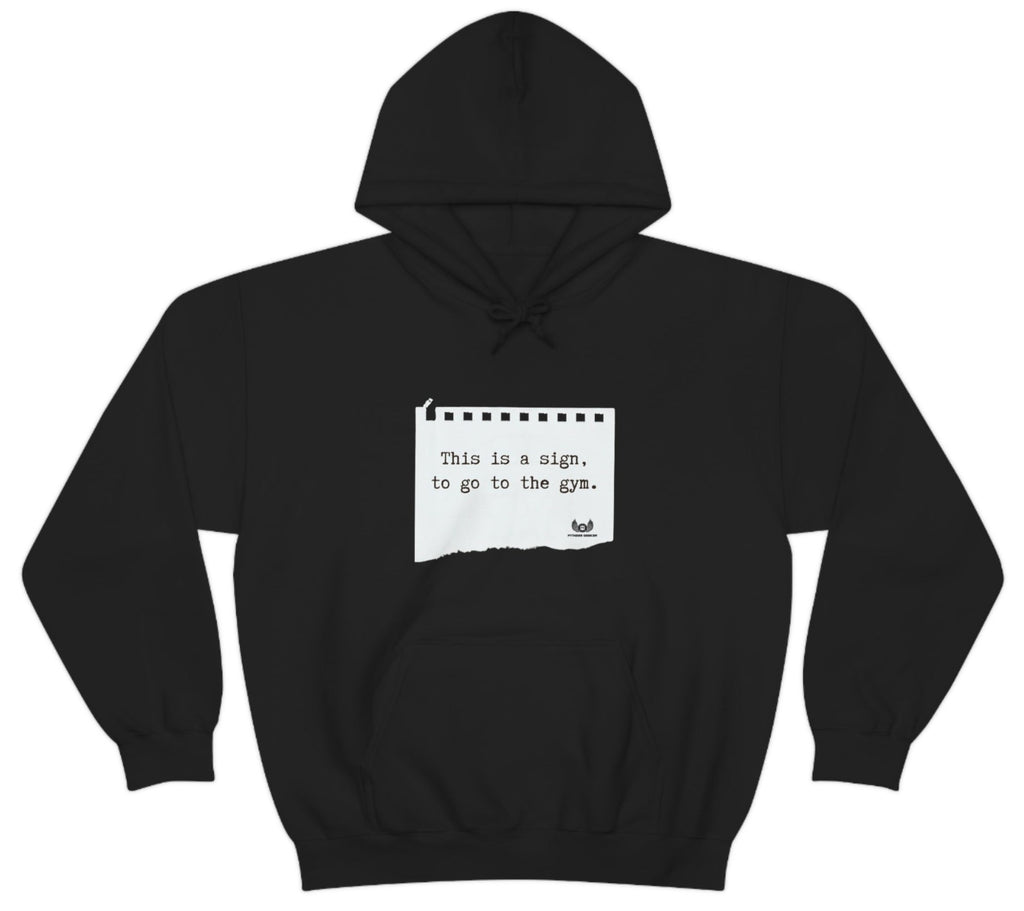 Picture of the Fitness Geeker graphic saying "This is a sign, to go to the Gym" Heavy Blend Hooded Sweatshirt (front) in black